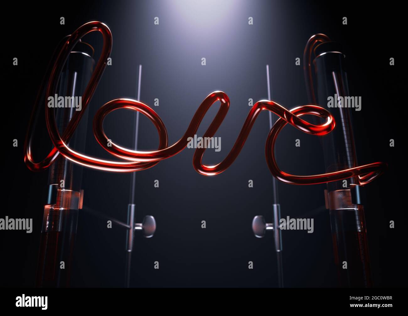 A concept of a glass chemistry set with the word love spelt out in red liquid in the pipes between two spotlit pipettes on an isolated dark background Stock Photo