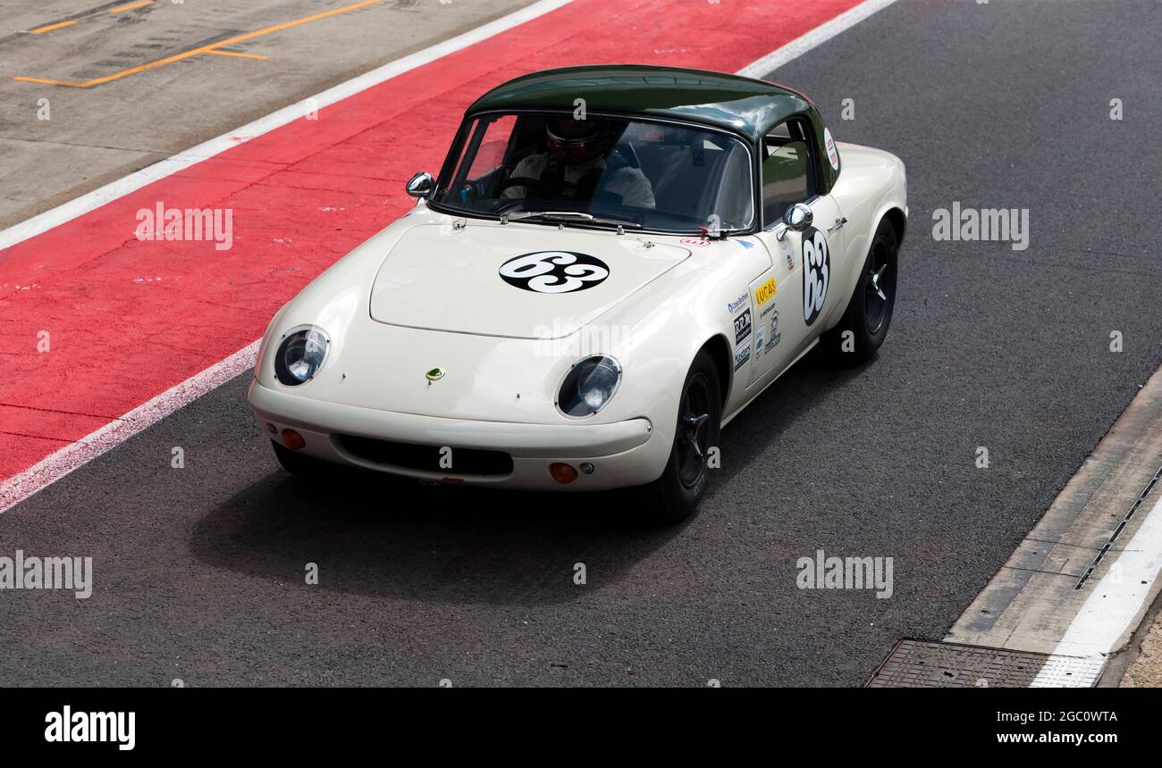 Jack Roderick's White, 1965, Lotus Elan, in the pit lane before the start of the International Trophy For Classic Pre-66 GT Cars at Silverstone Stock Photo
