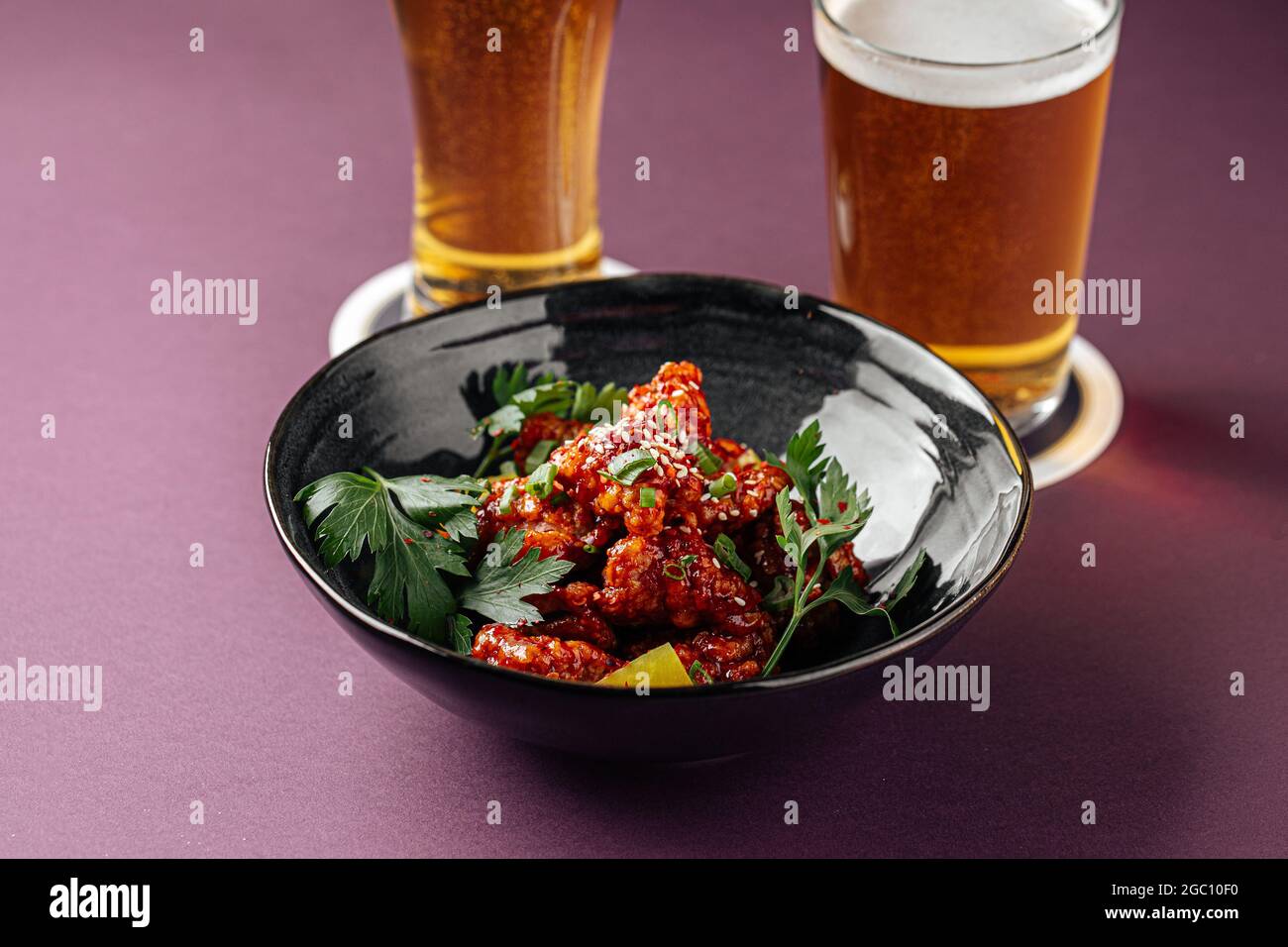 Japanese karaage chicken with beer on a purple Stock Photo