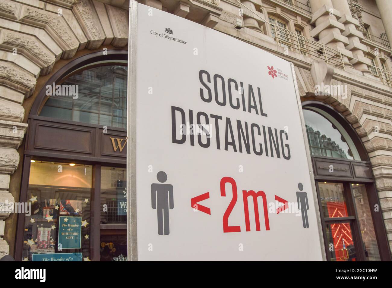 Detail of a social distancing sign on Regent Street during the coronavirus pandemic. London, United Kingdom 2021. Stock Photo