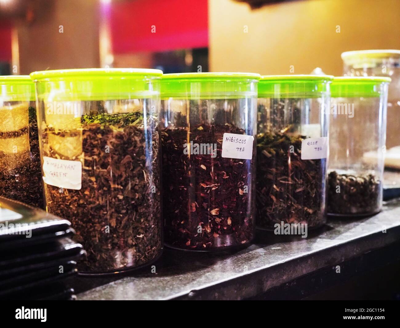 Different types of tea in round containers Stock Photo - Alamy