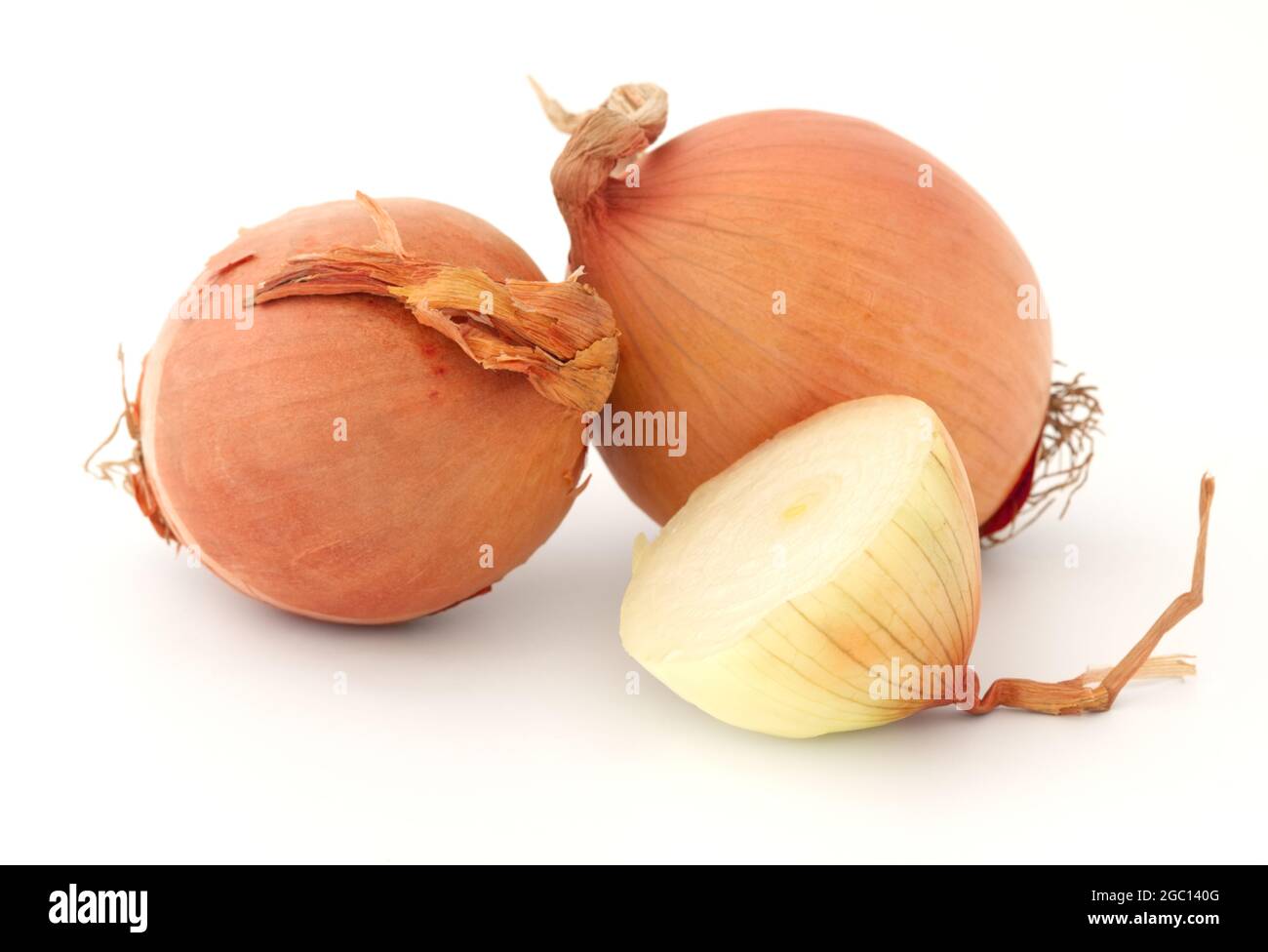 Fresh brown onion bulbs isolated on white background Stock Photo