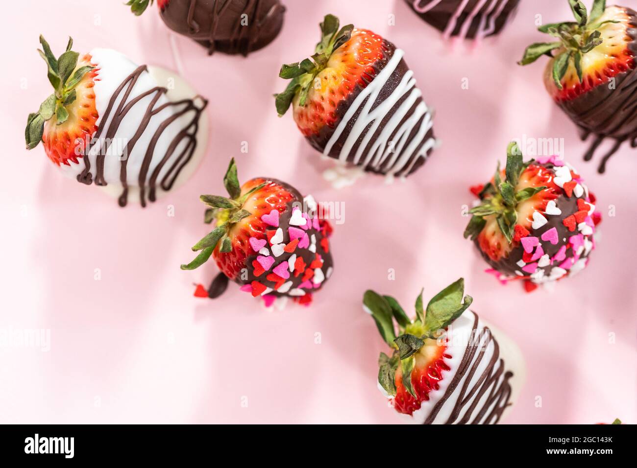 Variety of chocolate dipped strawberries on a pink background Stock ...