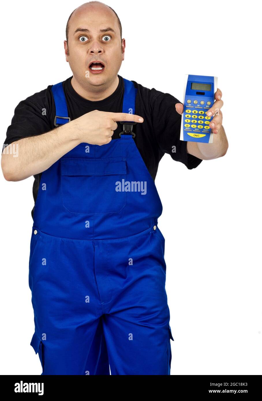 construction worker in blue dungarees pointing scared to a pocket calculator Stock Photo