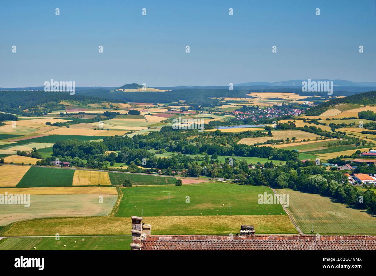 vista from Castle Saaleck near Hammelburg at the Rhoen with the village Winheim (in the back) and the Schwarzen Berge (Black Mountains), Germany, Stock Photo