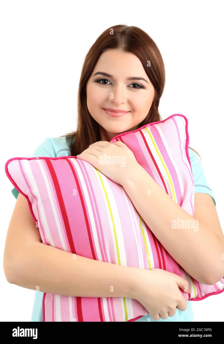 Beautiful young girl with pillow isolated on white Stock Photo Alamy