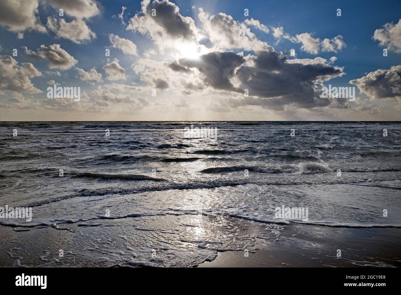 North Sea with outgoing waves against the light, Germany, Schleswig-Holstein, Sylt Stock Photo