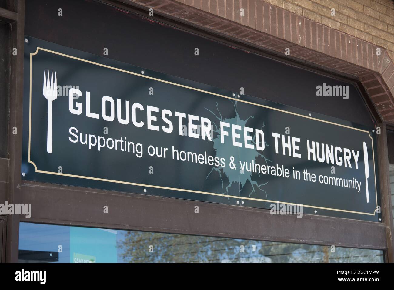 Gloucester feed the hungry sign in Gloucester in the UK Stock Photo Alamy