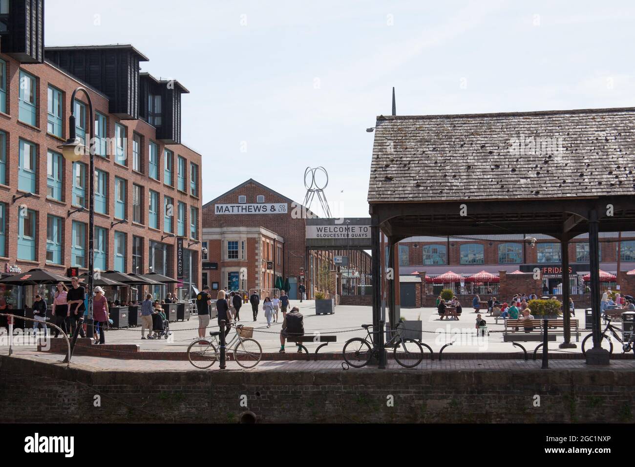 People, shops and restaurants at Gloucester Quays in the UK Stock Photo