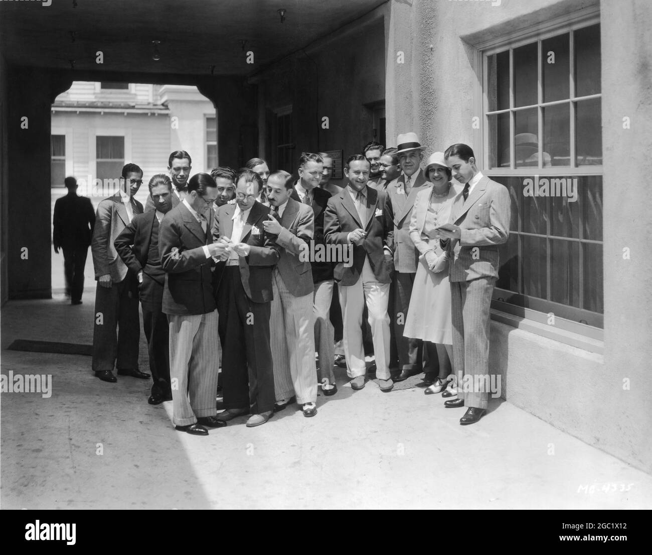 Music and Lyric Writers Musicians and Arrangers under contract to MGM Studios in 1930 studio lot candid with from left to right front : JOSEPH MEYER ARTHUR LANGE (Head of Music Department) ERNEST KLAPHOLZ ARTHUR FREED JIMMY McHUGH DOROTHY FIELDS and MARTIN BROONES. Back row : SAM FEINBERG CHARLES DRURY HARRY M. WOODS RAY HEINDORF GEORGE WARD HOWARD JOHNSON CLIFFORD GREY REGGIE MONTGOMERY and CHARLES MAXWELL publicity for Metro Goldwyn Mayer Stock Photo