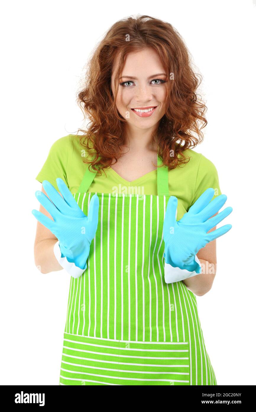 Young woman wearing green apron and rubber gloves, isolated on white ...