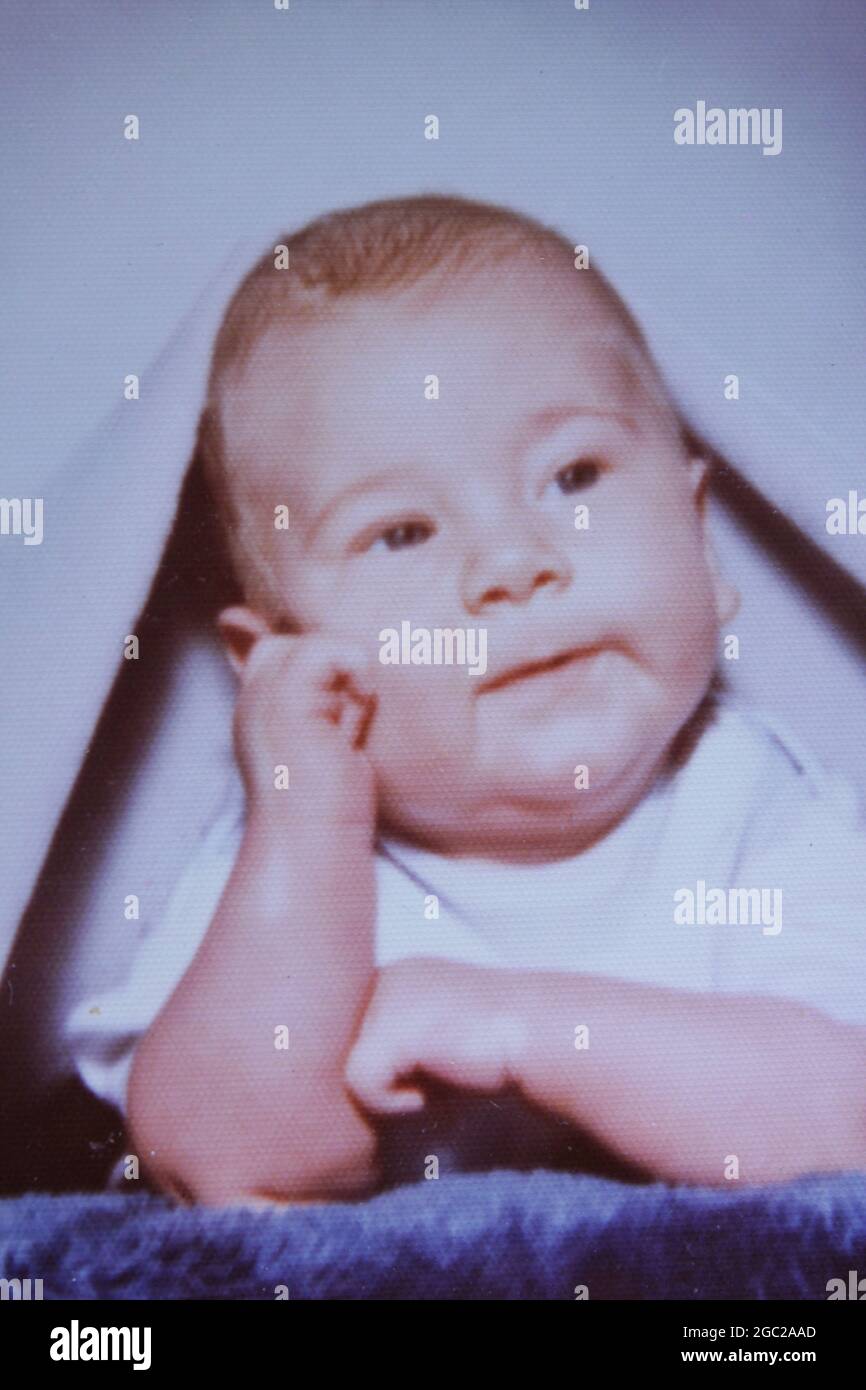 An old photo of a smiling baby boy. Stock Photo