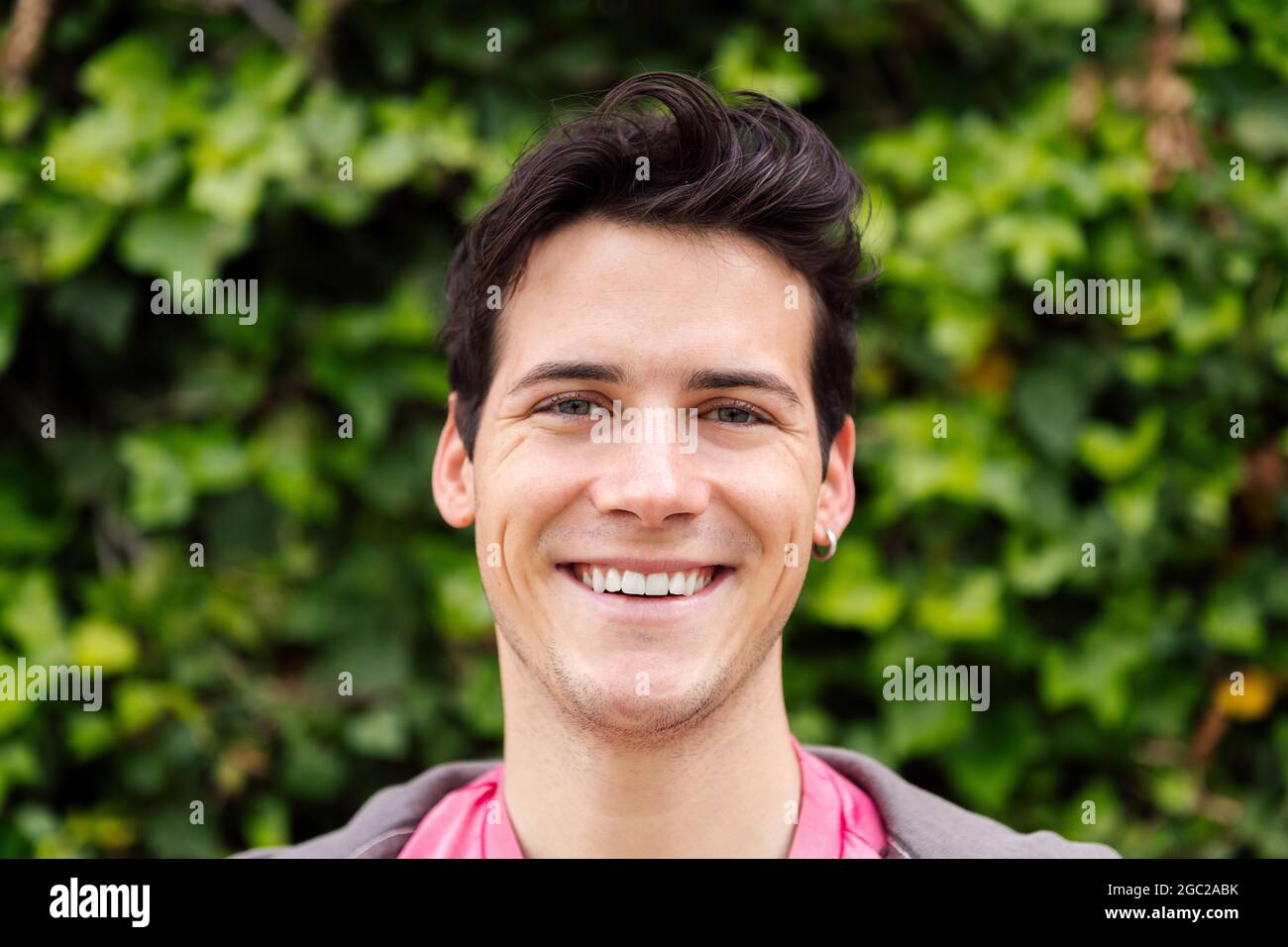 horizontal portrait of a handsome young man smiling, concept of happiness and teenager lifestyle Stock Photo