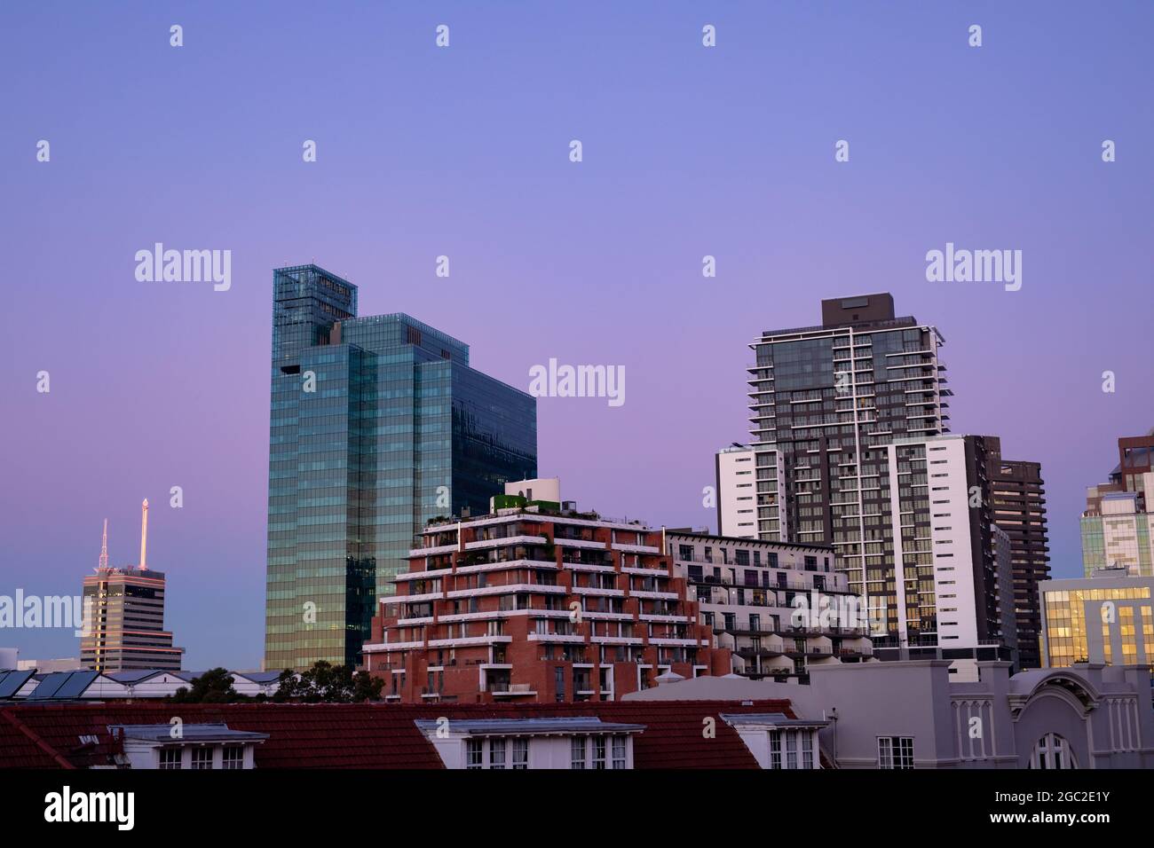 Modern high rise buildings in built up business district of modern city with dusk sky Stock Photo