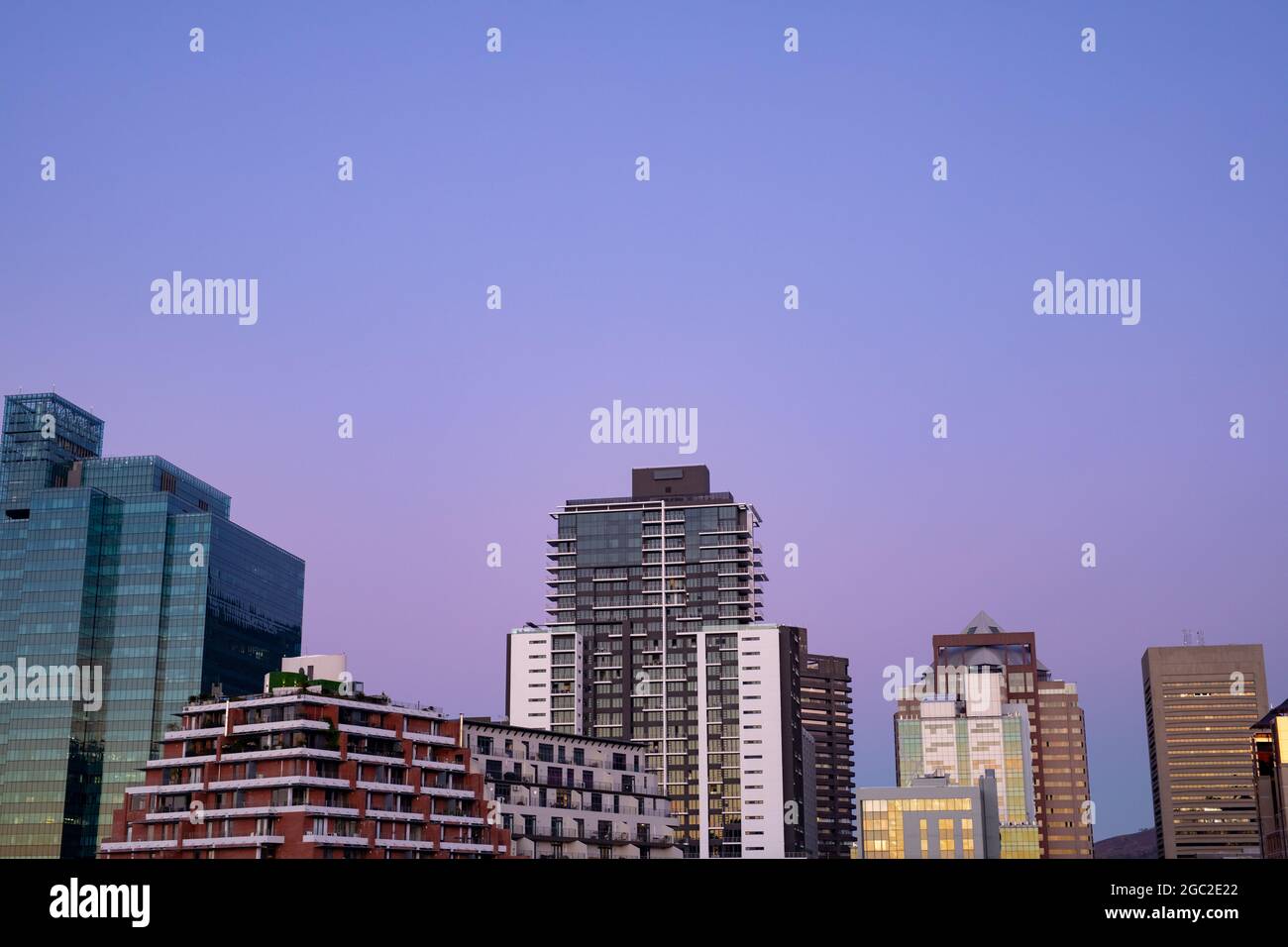 Modern high rise buildings in built up business district of modern city with dusk sky Stock Photo