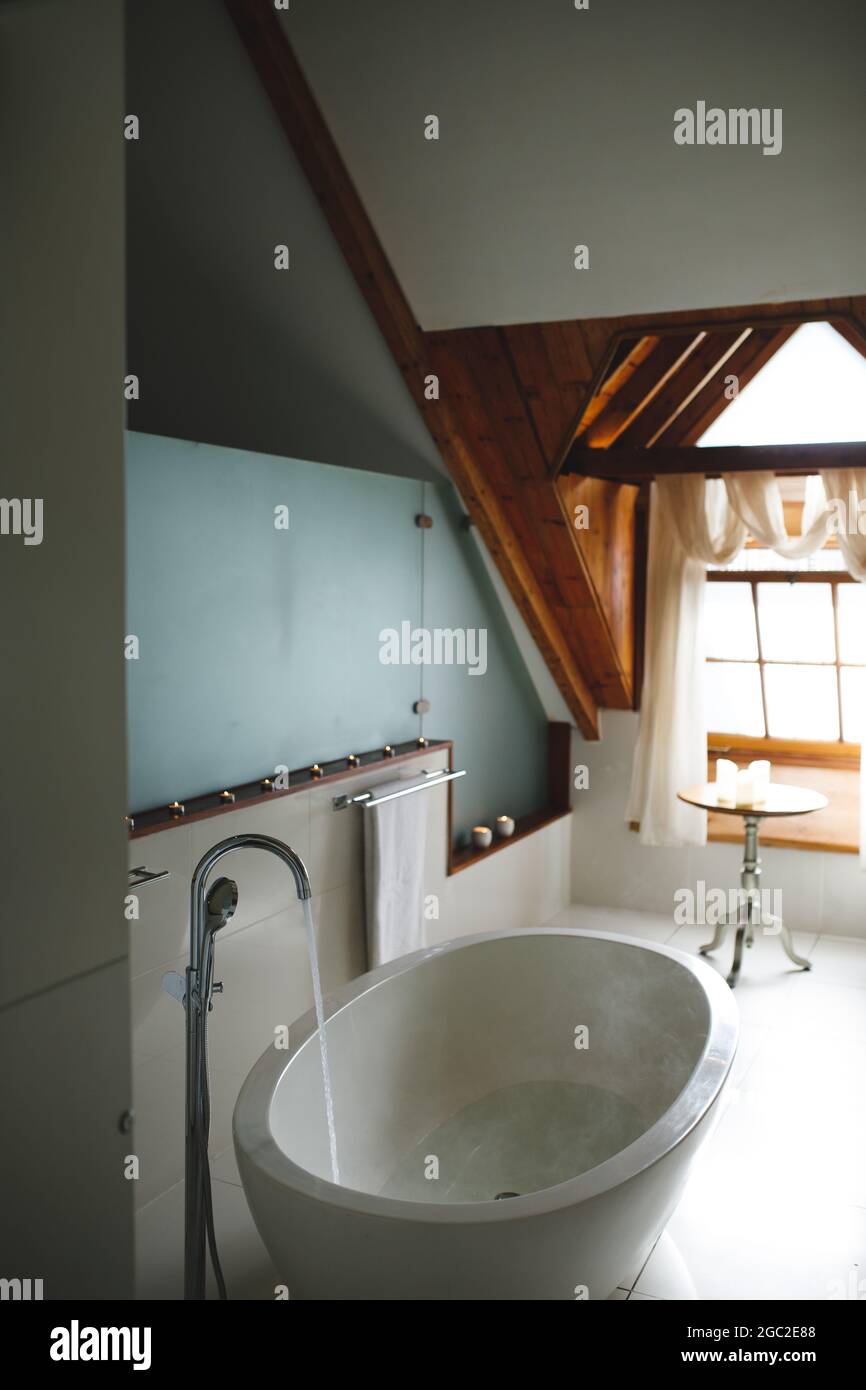 Interior of luxury bathroom and bath with running water Stock Photo