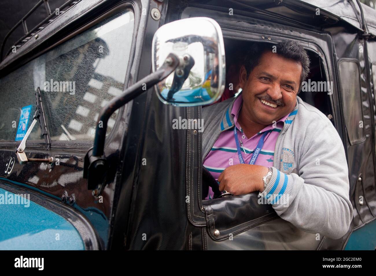Local tour guide in an iconic Willys Jeep, Salento, Colombia. Stock Photo