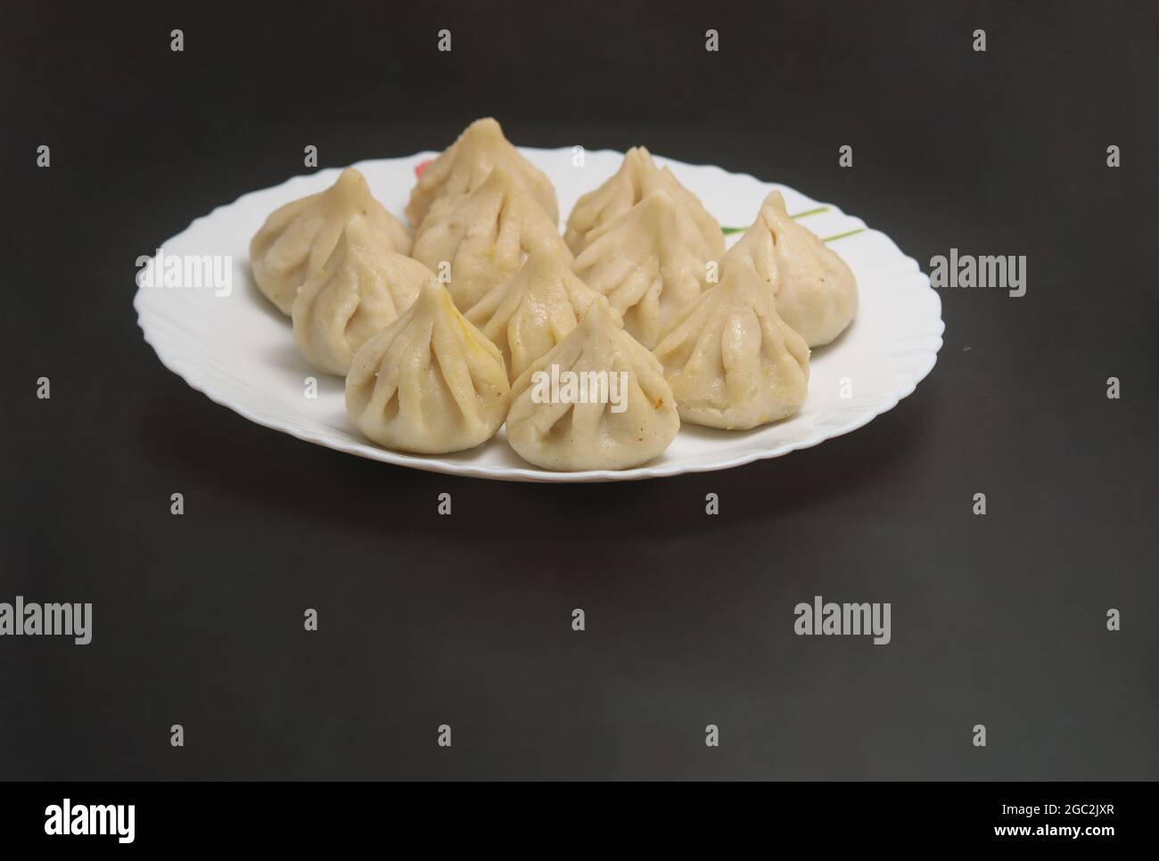 Steamed Modak, made from rice flour and coconut jaggery filling. Modak is a traditional Indian sweet made during Ganesh Utsav and also offered to lord Stock Photo