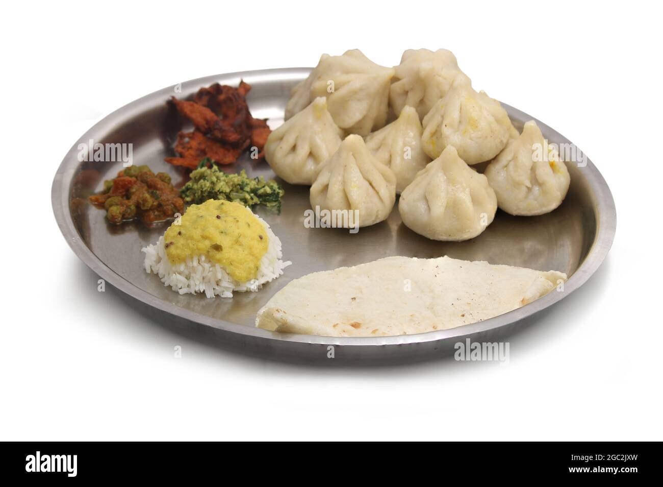 Traditional Hindu pooja dishes, close up photo of Indian traditional vegetarian thali from rice, dal, Modak, Baji, sabji, bhakri Stock Photo