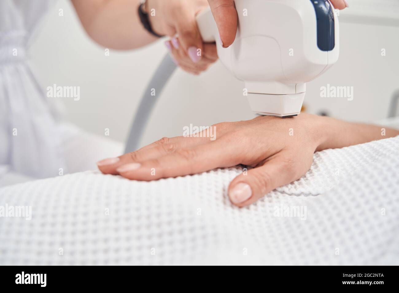 Woman during laser epilation process in beauty clinic Stock Photo Alamy