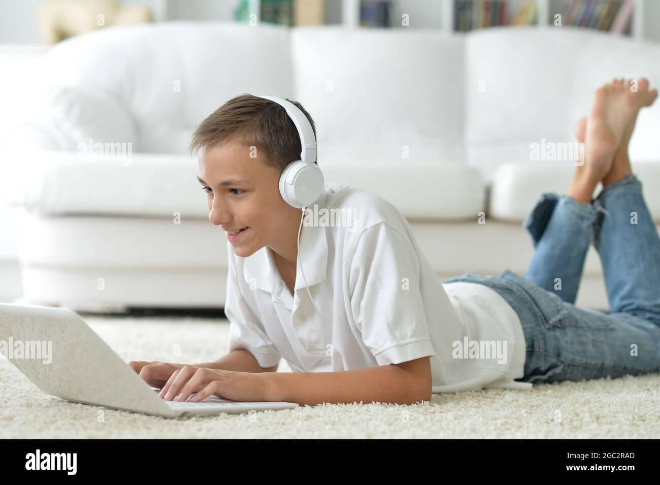 Portrait of boy using modern laptop at home Stock Photo - Alamy