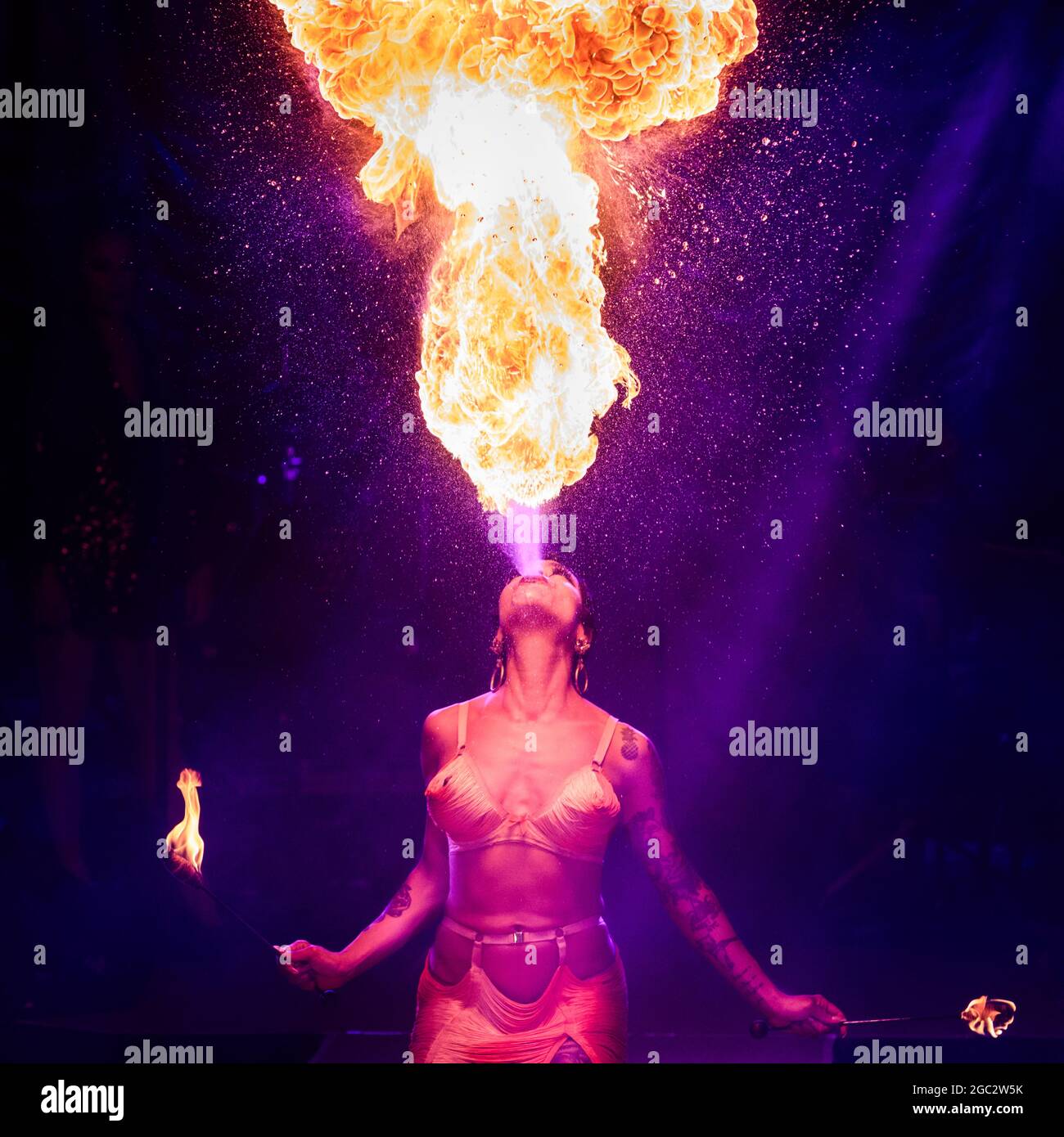 Heather Holliday, fire-breather performance artist, performs at cabaret-variety 'La Clique', London (photocall) Stock Photo