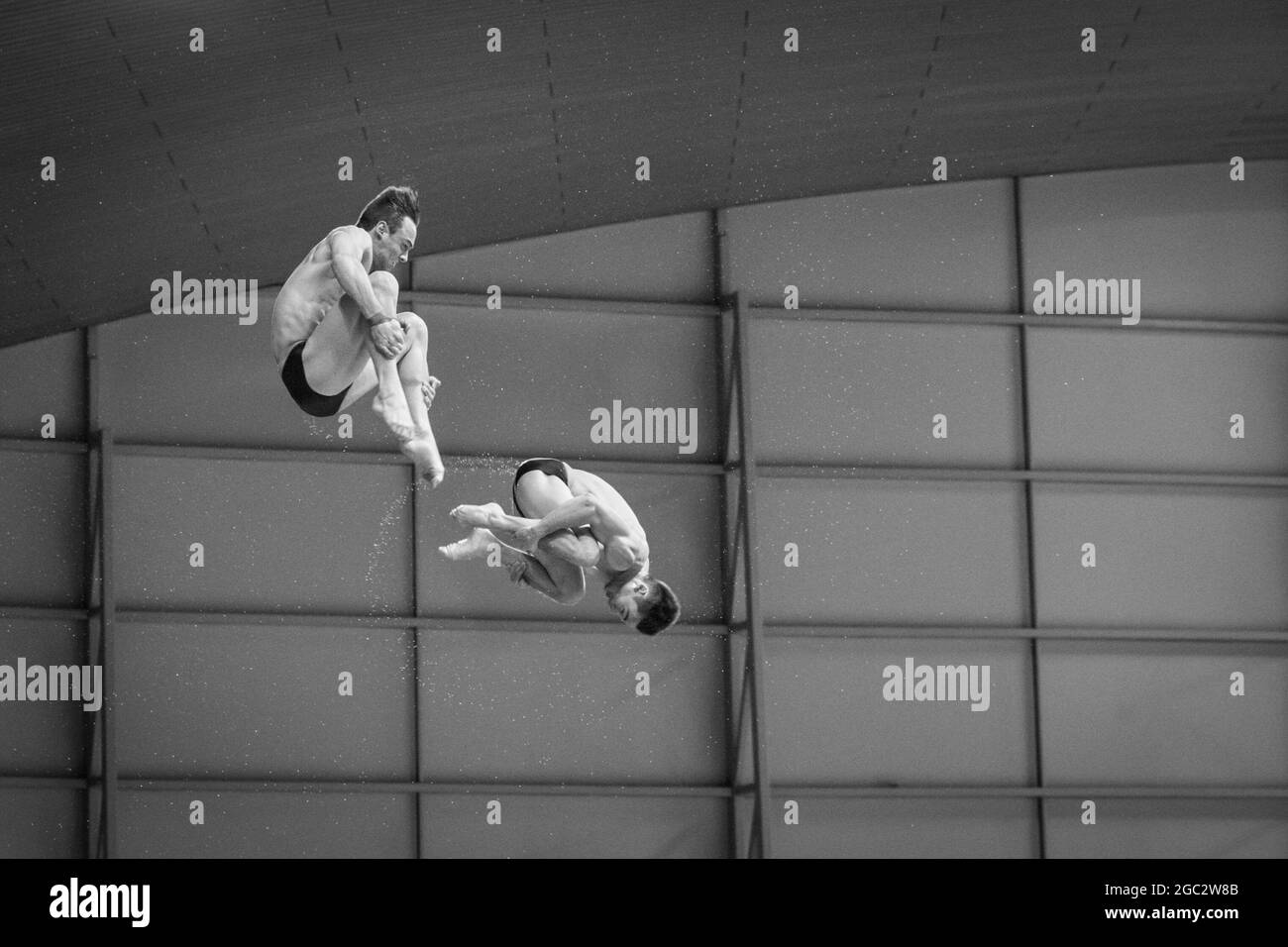 British divers Tom Daley (front) and Daniel Goodfellow in a 10m platform synchro dive, European Diving Championships, London, UK Stock Photo