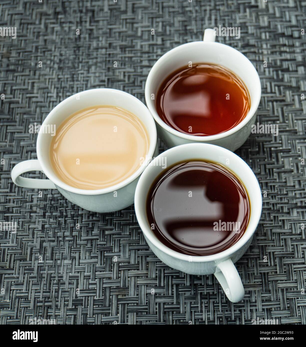 3 cups of tea: weak, strong or with milk Stock Photo