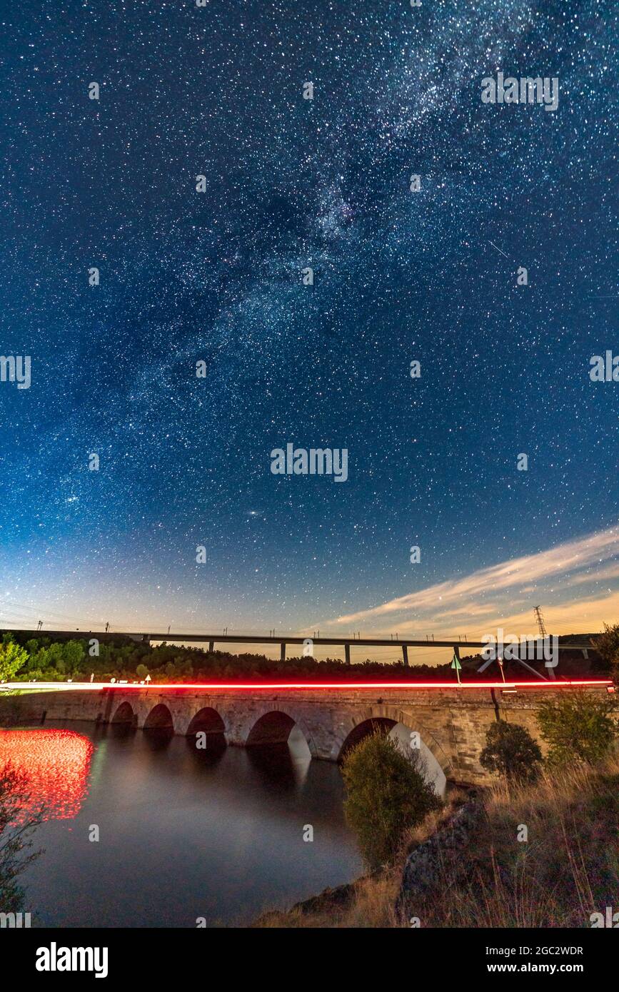 Two bridges and milky way with car light trails Stock Photo - Alamy