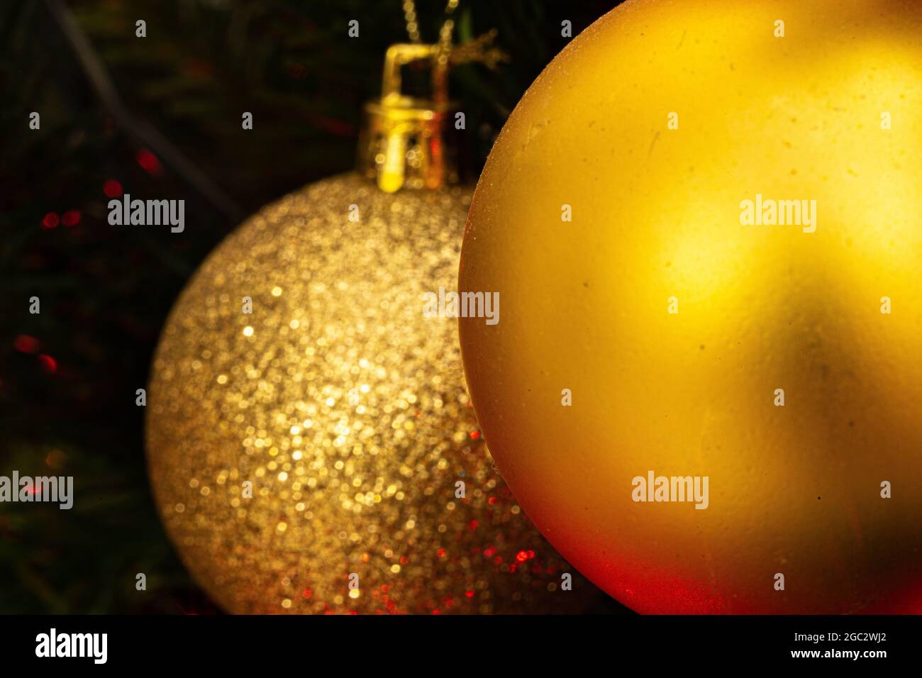 Various Christmas tree decorations and red blurred light on background Stock Photo