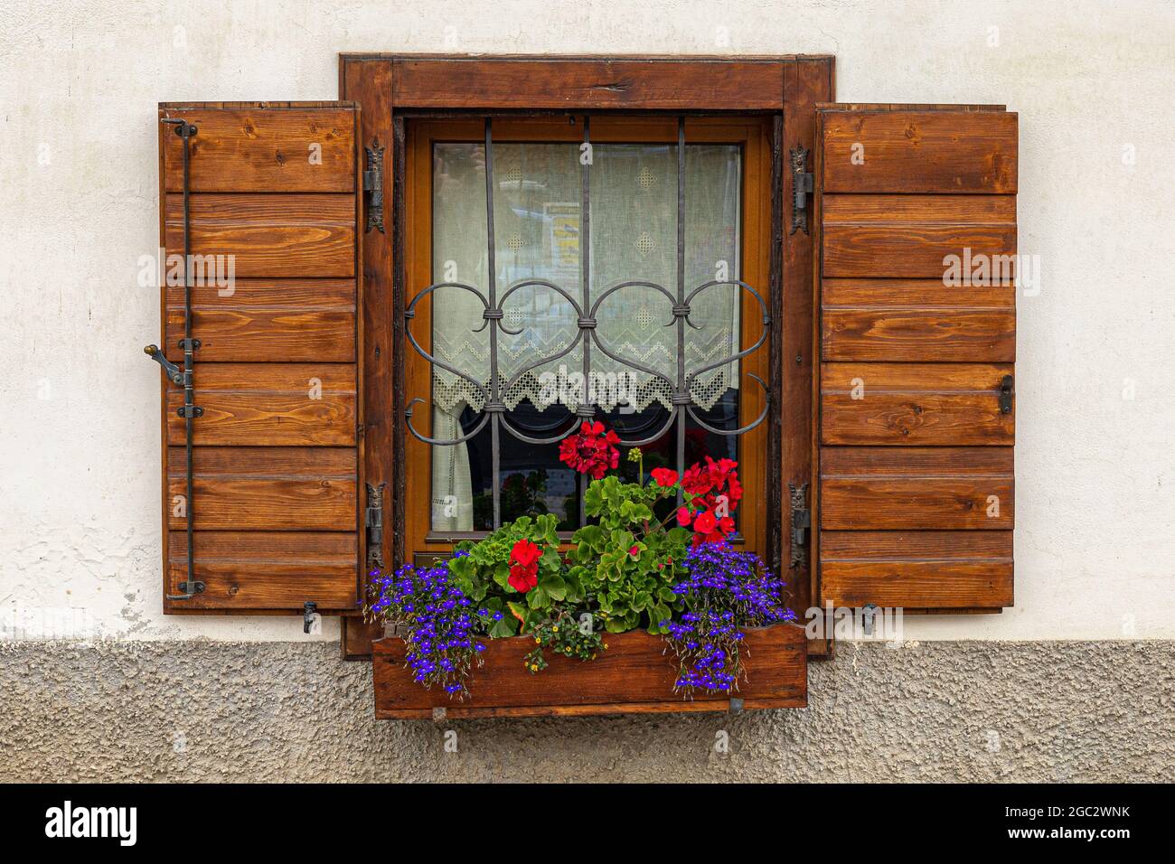 Alpine Window Styles Typical alpine house windows with flowering plants Stock Photo - Alamy