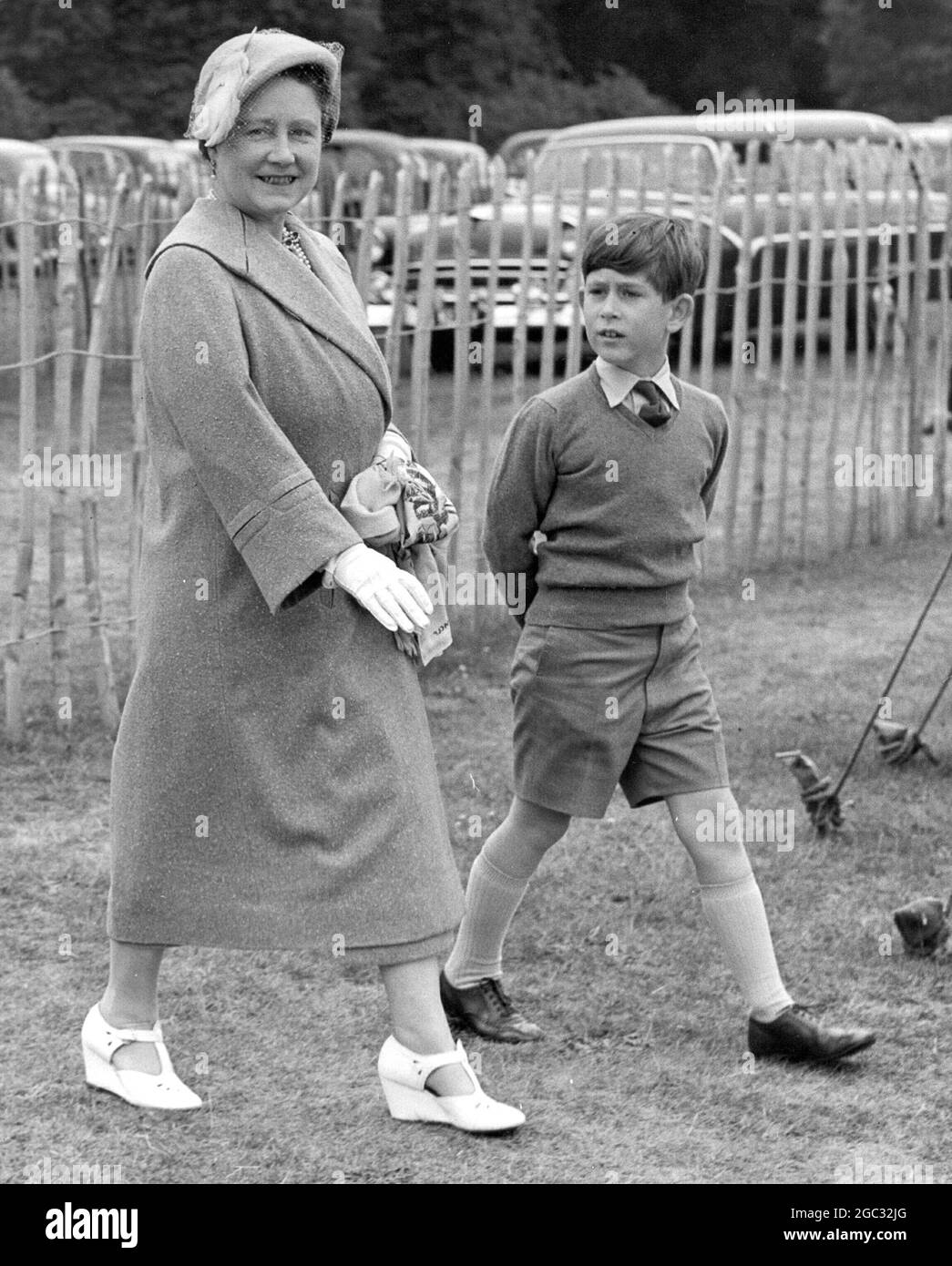 The Queen Mother with Prince Charles on the way to watch the Duke of Edinburgh play polo. Smith's Lawn, Windsor Great Park - 10th June 1957 Stock Photo