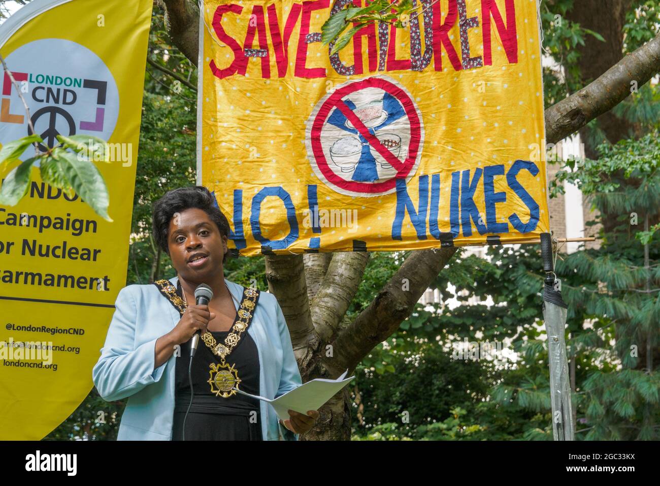 London, UK. 6th August 2021. Sabrina Francis, Mayor of Camden speaks. 76 years after atomic bombs were dropped on Hiroshima and Nagaski, London CND met at the Hiroshima Cherry tree in Tavistock Square to remember the many killed and survivors who are still suffering the event, and to celebrate the UN treaty prohibiting nuclear weapons which came into force this January. They called on the government to end the UK's nuclear weapon programme. Peter Marshall/Alamy Live News Stock Photo