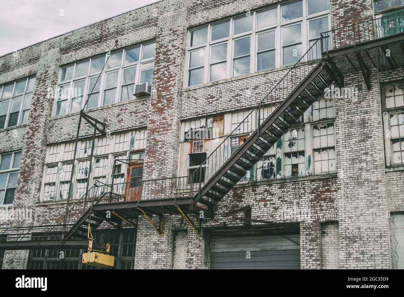 Old abandoned building with destroyed windows and stairs Stock Photo ...