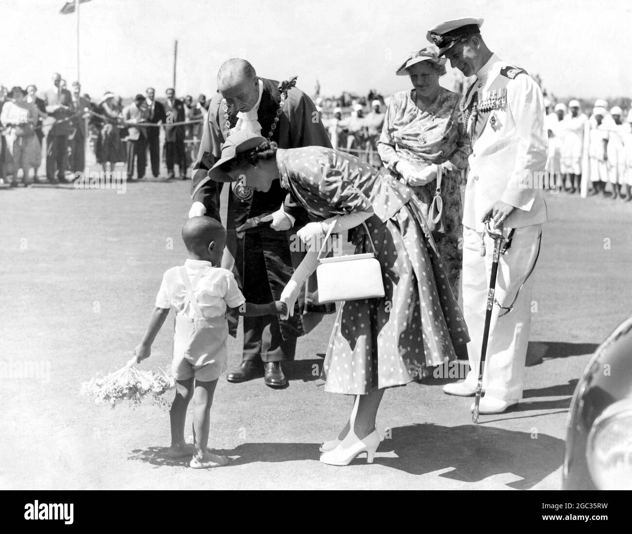 Princess Elizabeth tries to coax little Prince Salim into presenting