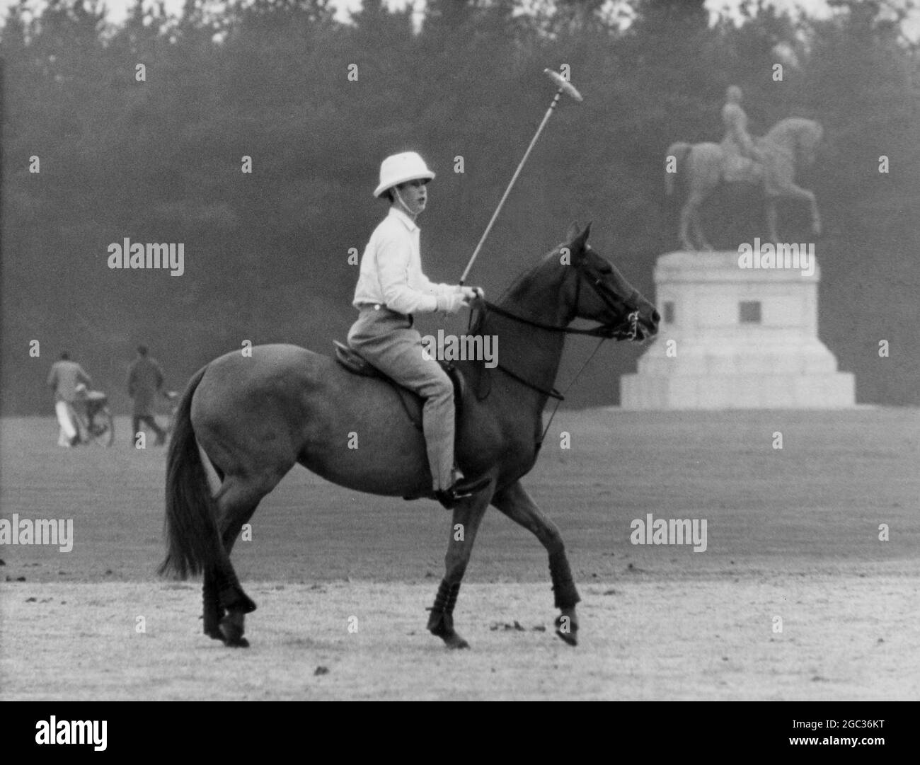 Prince Charles wearing white topee and jodhpurs sits on his pony during polo practice on Smith's Lawn near Windsor Castle April 1964 Stock Photo
