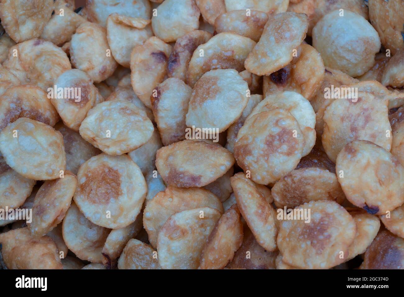 Kochuris are being sold in Territy Bazar, Kolkata, West Bengal, India. Kochuri, kachori of kachauri is a spicy snack, fried dumpling and a very popula Stock Photo