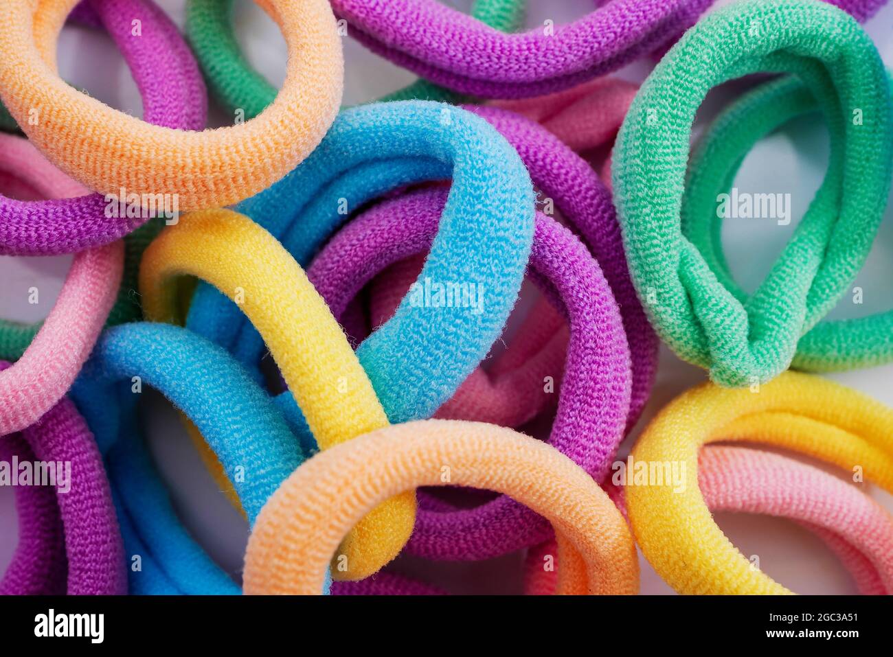 Closeup of various hair ties. Macro of multicolored elastics Stock Photo