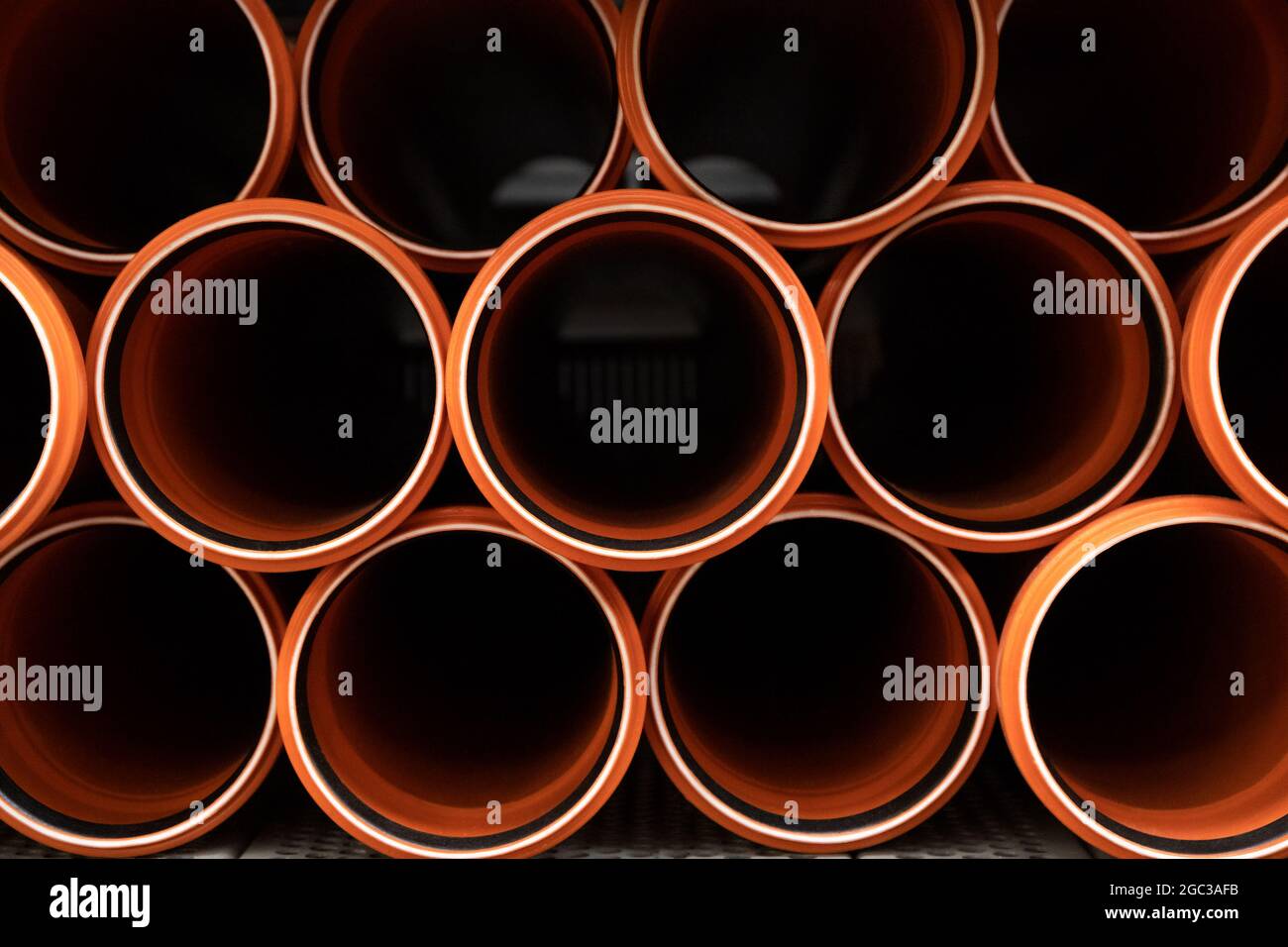 Stack of PVC U canalization pipes plumbing tube on a hardware store