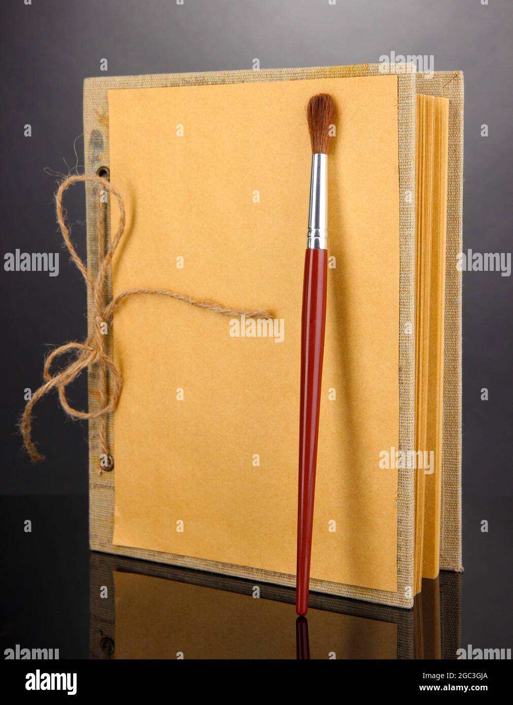 Beautiful old notebook on grey background Stock Photo - Alamy