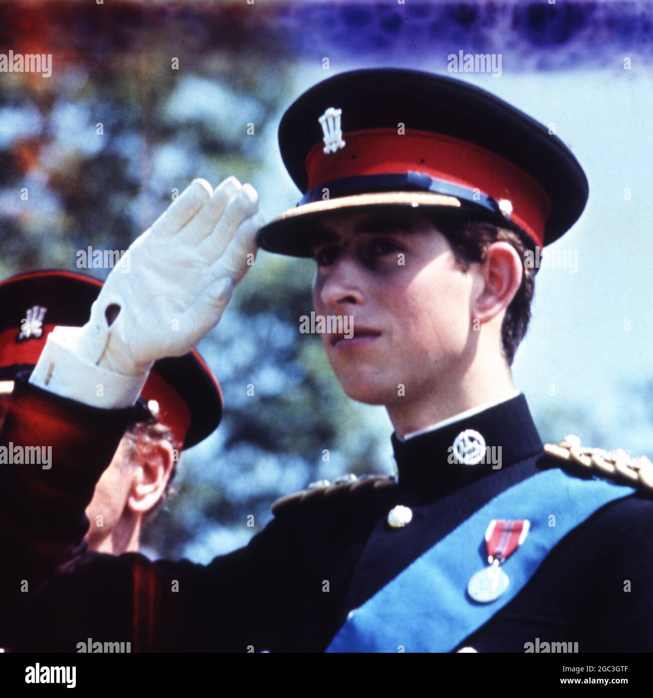 Prince Charles in uniform takes the salute. Stock Photo