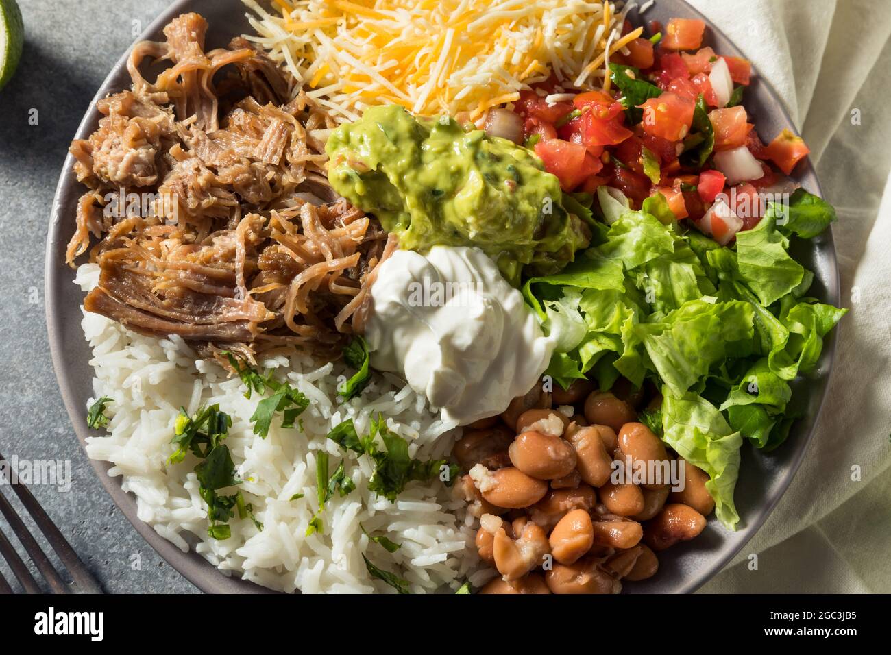 Healthy Homemade Mexican Carnitas Burrito Bowl Cilantro and Guacamole Stock Photo