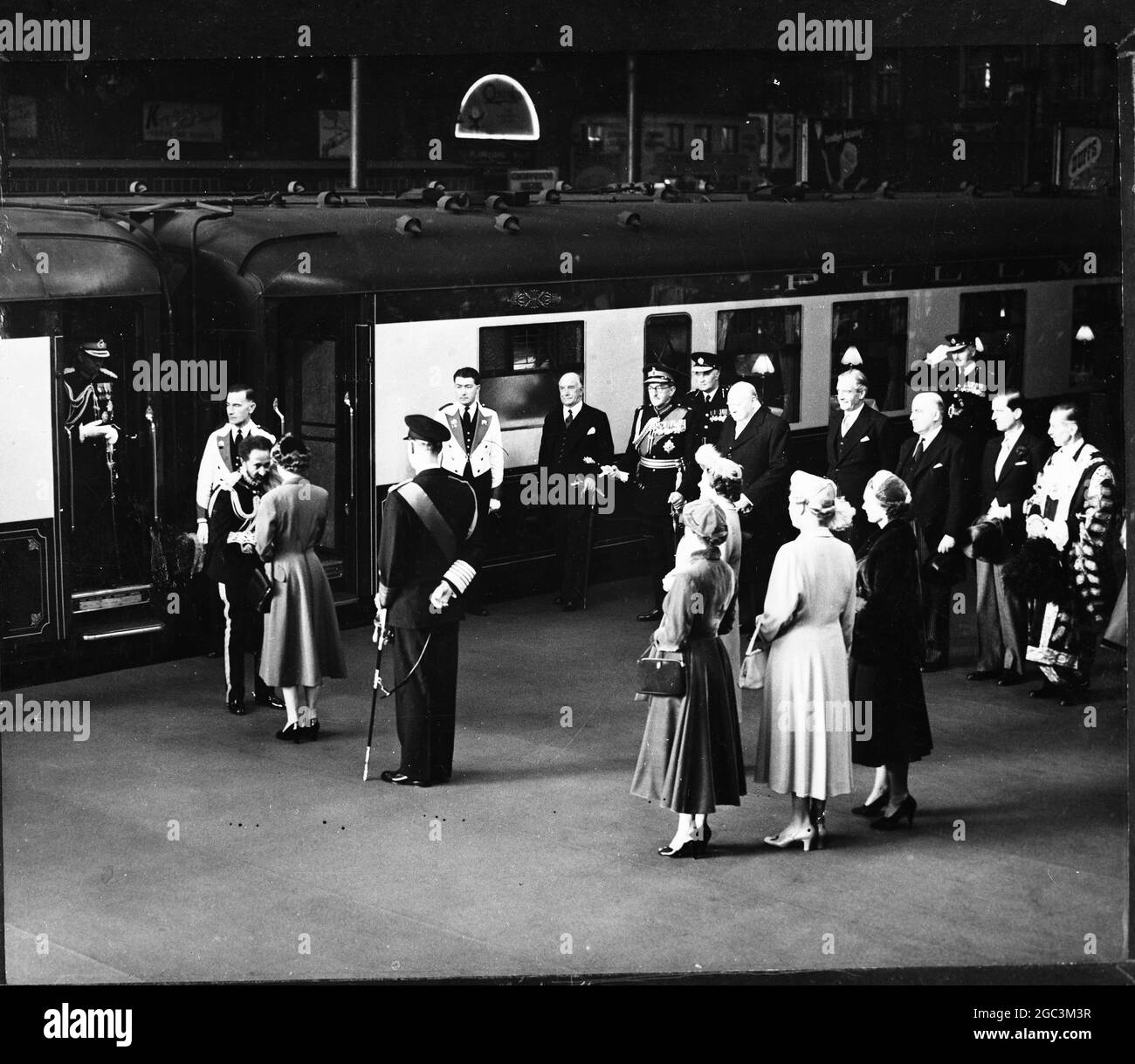 Royal Family Welcome Emperor Queen Elizabeth greeting Emperor Haile Selassie of Ethopia on his arrival at Victoria Station , on his three day state visit . Standing behind the Queen are the Duke of Edinburgh and the Ladies of the Royal Family , The Queen Mother Princess Margaret , The Princess Royal , and the Duchess of Gloucester . Background right are Prime Minister WInston Churchill , Foreign Minister Anthony Eden , Home Secretary Sir David Maxwell Fyfe and Viscount Alanbrooke 14th October 1954 Stock Photo