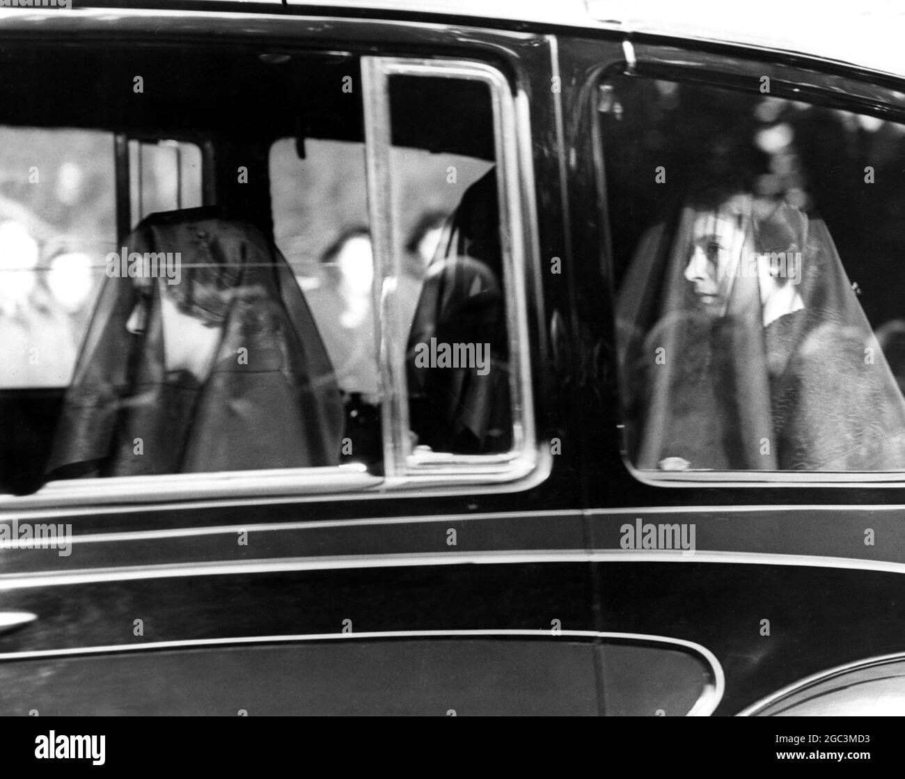 11 February 1952 Queen Elizabeth II (back), and The Queen Mother veiled in mourning on their way from Sandringham for Wolferton Station to travel with the body of King George VI to London, England. ©TopFoto Stock Photo