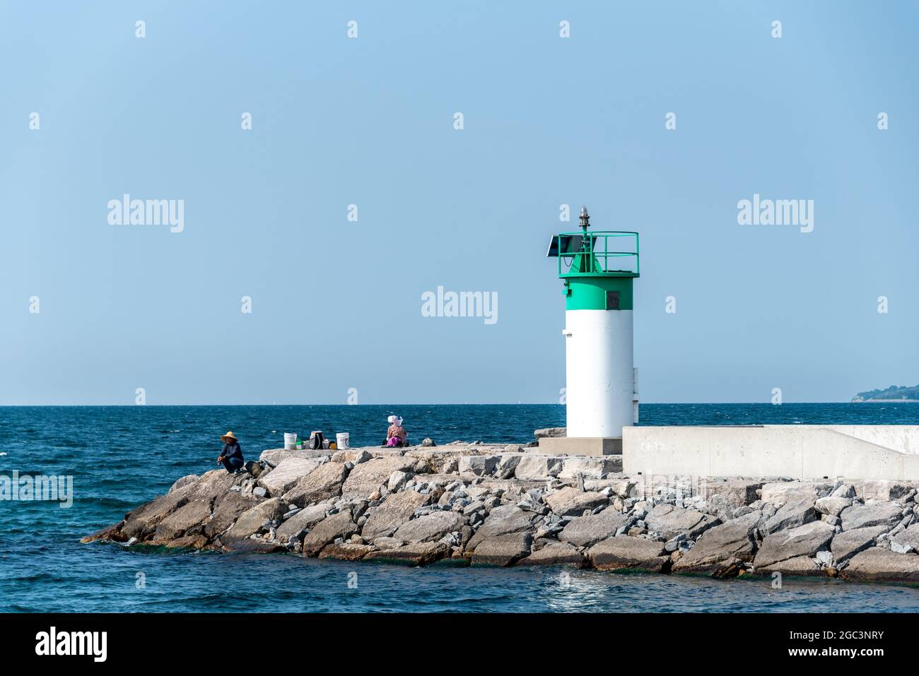Lighthouse at the Frenchman's Bay Harbor entrance located in the coast of Lake Ontario in Pickering City, Ontario, Canada Stock Photo