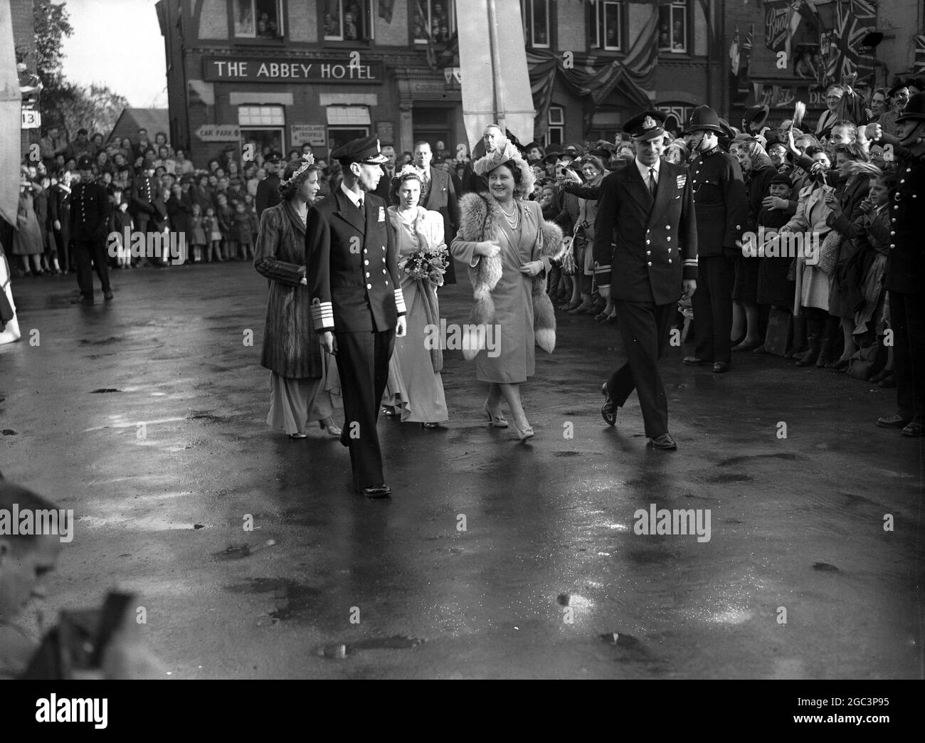 Three Royal Princesses were bridesmaids at the wedding of the Hon. Patricia Mountbatten to Captain the Lord Brabourne . Here , arriving at Romsey Abbey , are Princess Elizabeth , King George VI , Princess Margaret , Queen Elizabeth , and Lieutenant Philip Mountbatten 26 October 1926 Stock Photo