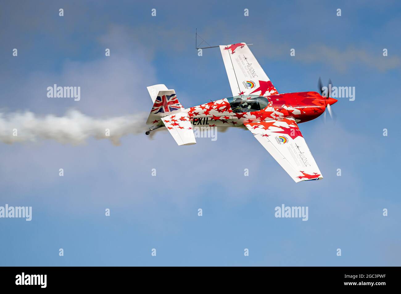 Little and large Extra Duo display team performing a fantastic aerobatic routine at Shuttleworth Family Airshow on the 1st August 2021 Stock Photo