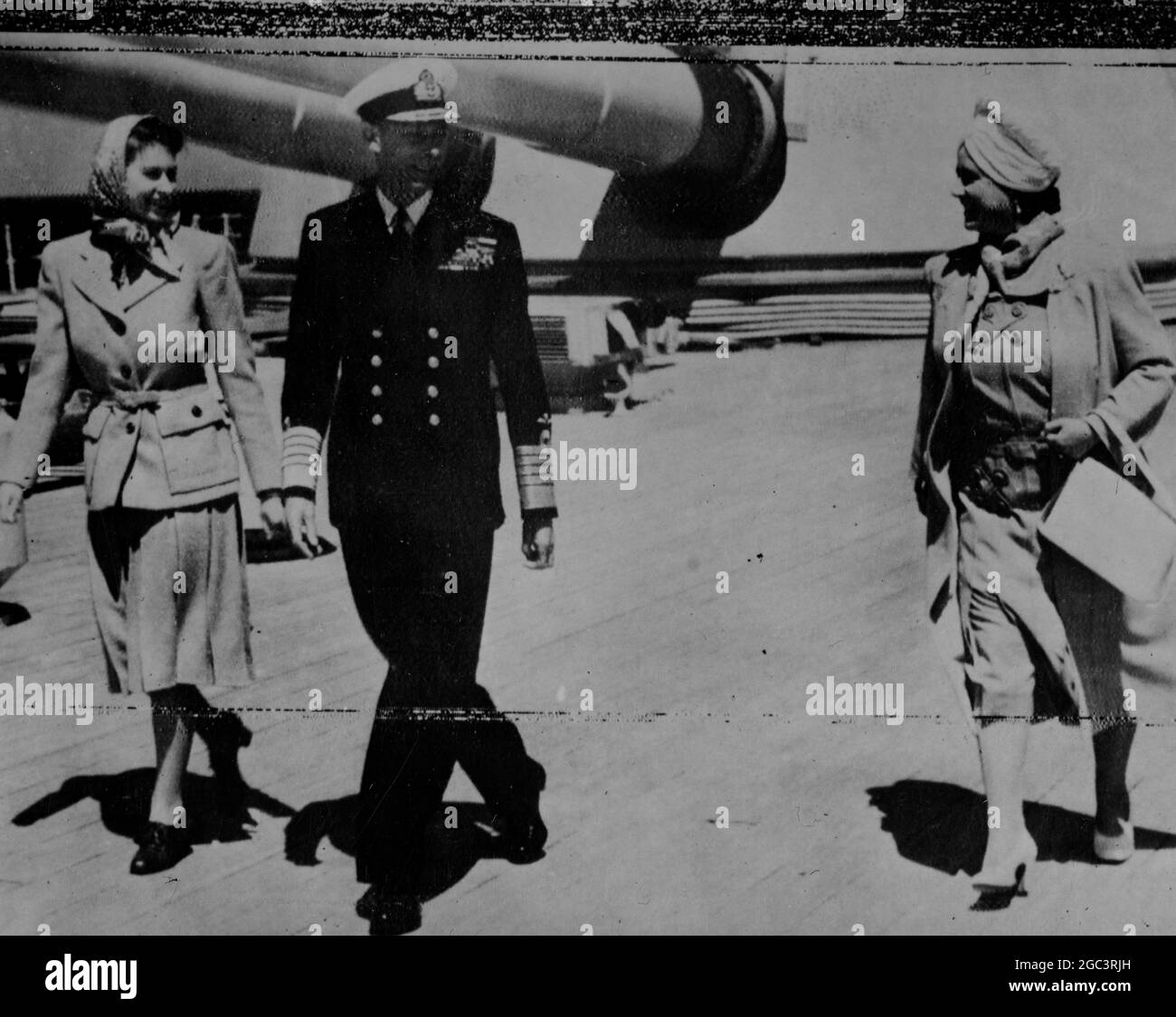 The King and Queen with Princess Elizabeth enjoying a constitutional on the quarter deck of HMS Vanguard, when the vessel was off Portugal yesterday. The King has recovered from his cold. Thousands are expected to gather on Southsea beach tomorrow to see the Vanguard enter Portsmouth harbour. 9 May 1947 Stock Photo