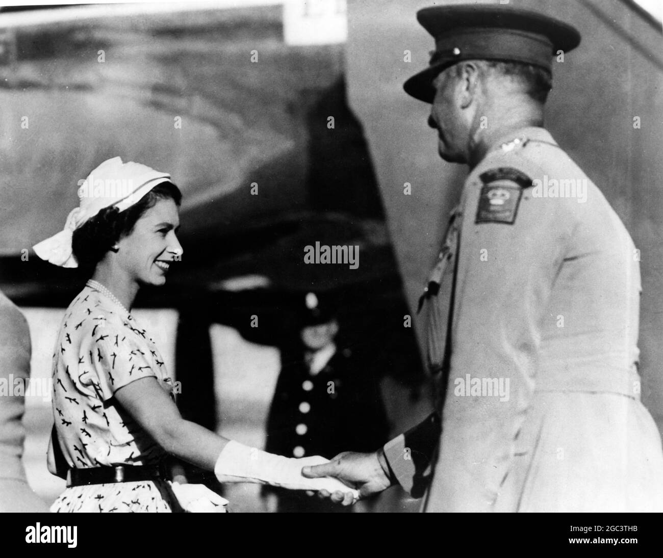 Broken Hill, New South Wales: H.M Queen Elizabeth II has a farewell smile for Sir William Slim, Governor-General of Australia, just before leaving Broken Hill with the Duke of Edinburgh in an aircraft that took them to the start of their tour of Adelaide, South Australia. 27 March 1954 Stock Photo