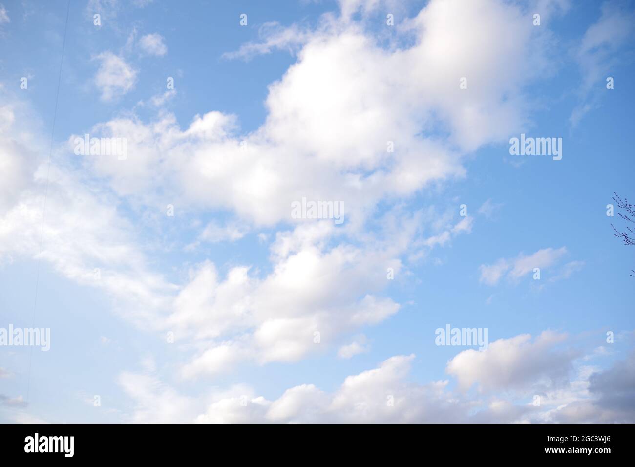 Clear blue sky and white clouds summer background Stock Photo - Alamy